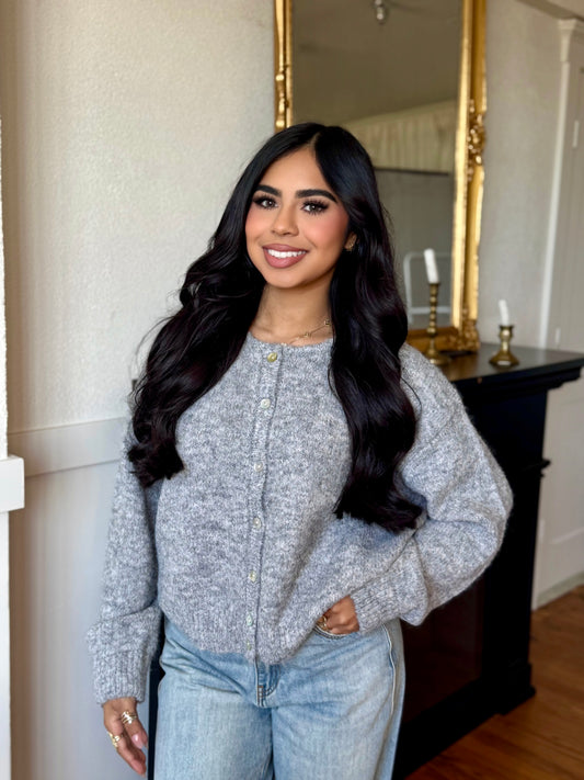 like her gray cardigan